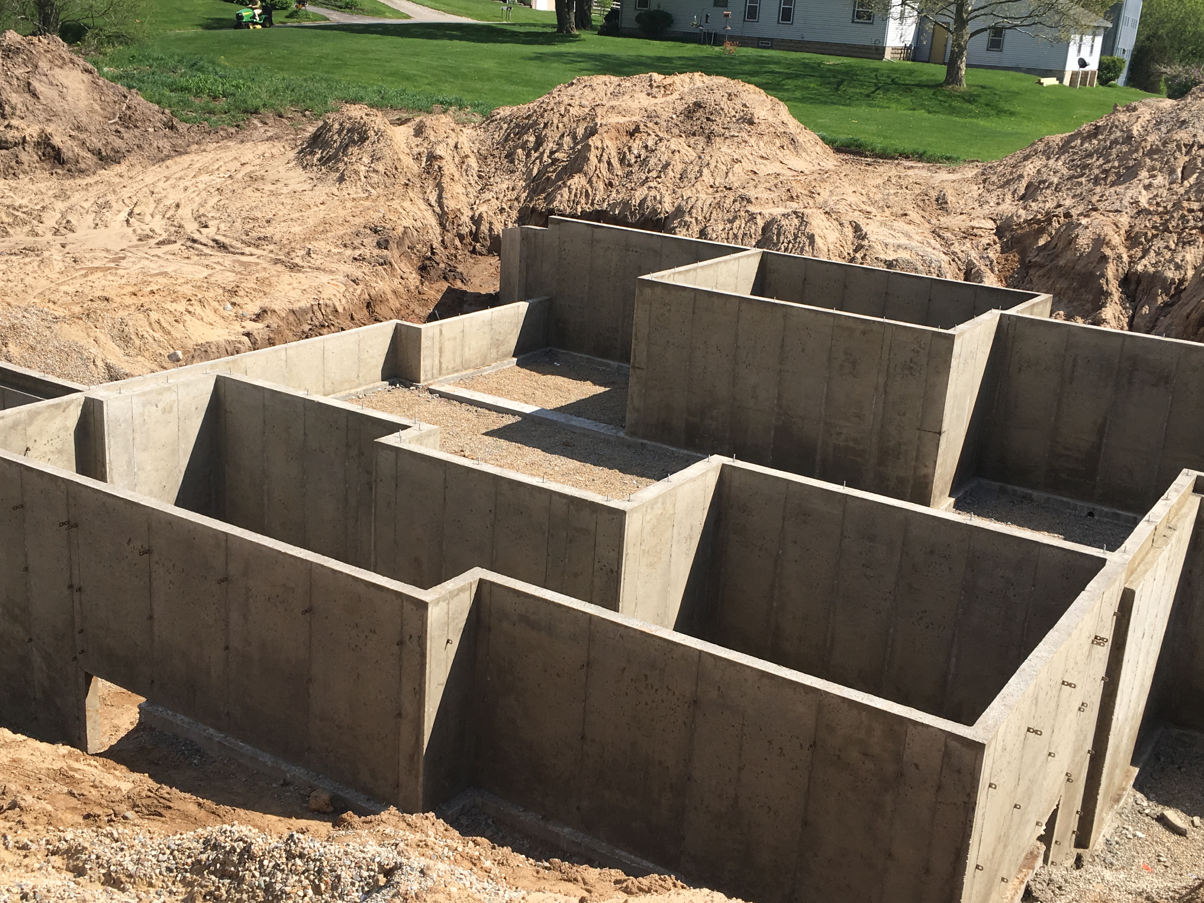 poured concrete walls vs block cost